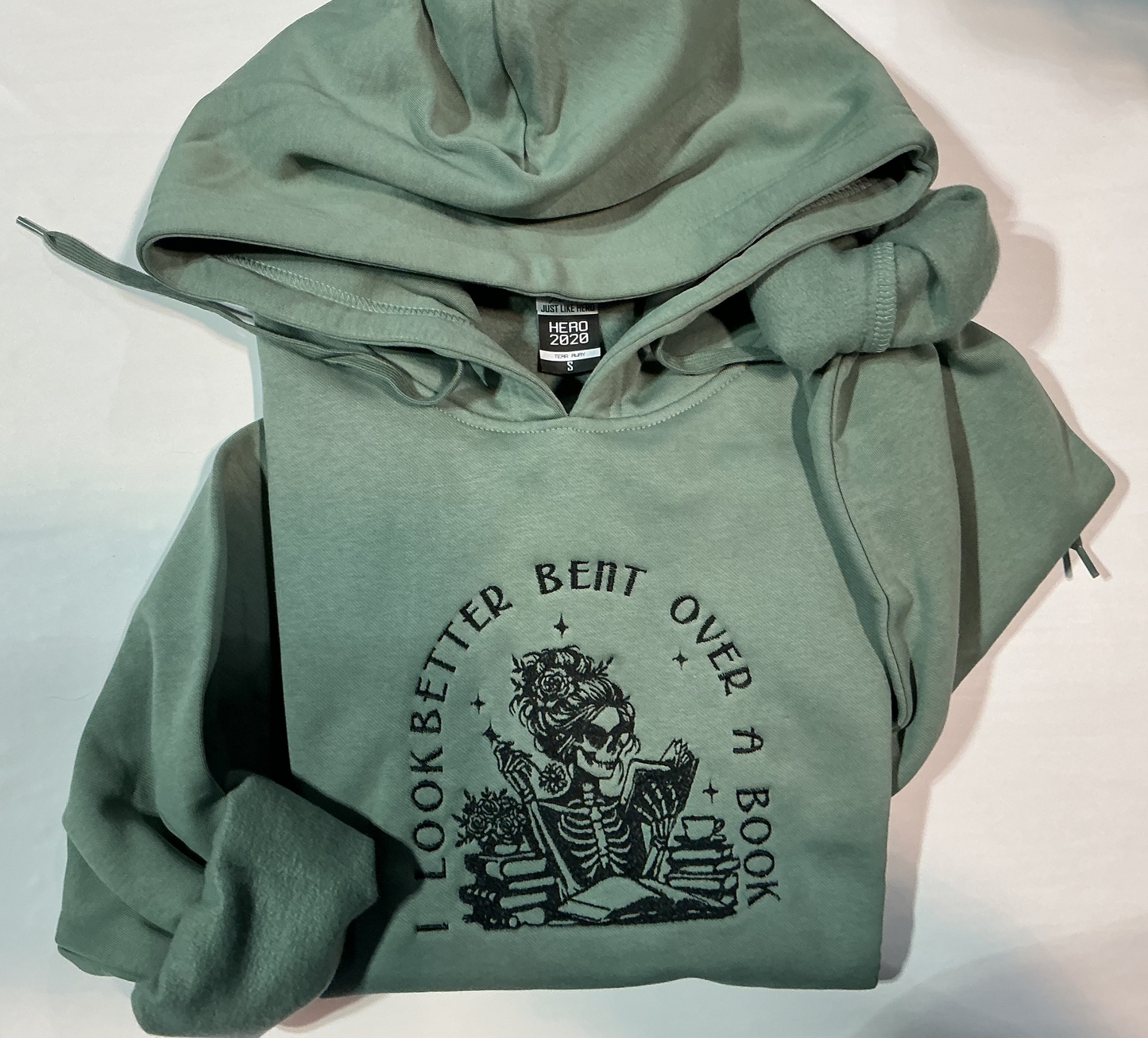 Bent over a book hoodie